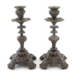 A pair of Victorian cast candlesticks with stylised foliage, swag and scrolling detail. Approx. 8