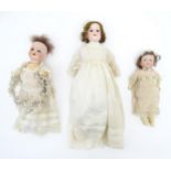 Toys: Three dolls comprising a German Armand Marseille doll with a bisque head and painted lips,