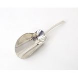 A silver caddy spoon / sugar shovel hallmarked London 1981, maker CRT . Approx. 3" long Please