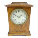 An oak cased mantle clock with 8-day movement stamped ' Newhaven Trademark British Manufacture '