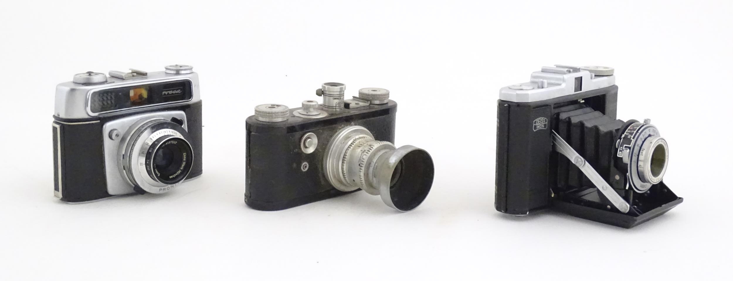 A quantity of 20thC cased cameras to include a Zeiss Ikon Nettar 517/16 camera, a Corfield - Image 15 of 24