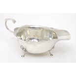 A silver sauce boat hallmarked Birmingham 1961, maker Adie Brothers Ltd. Approx. 6 1/4" long