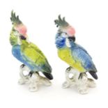Two Karl Ens models of parrots / cockatiels in blue and yellow with pink heads. Marked under.