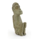 Ethnographic / Native / Tribal: An African stone carving modelled as a seated figure. Approx. 6"
