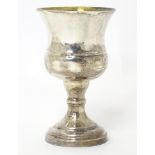 A silver pedestal cup hallmarked London 1977 with silver jubilee mark, maker B. P. Co. Approx. 4"
