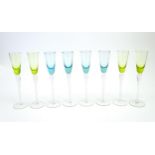 Eight retro glass drinking glasses the turquoise and lime coloured bowls with air twist details to