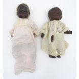 Toys: An early 20thC Armand Marseille black baby doll with a bisque head, blinking eyes, red painted