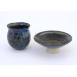 Two items of studio pottery comprising a footed bowl of tapering form with a blue glaze, incised