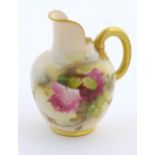 A Royal Worcester flatback jug with a shaped spout, with painted decoration depicting rose flowers