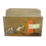 A Victorian oak wall hanging letter rack / holder with painted decoration depicting two children