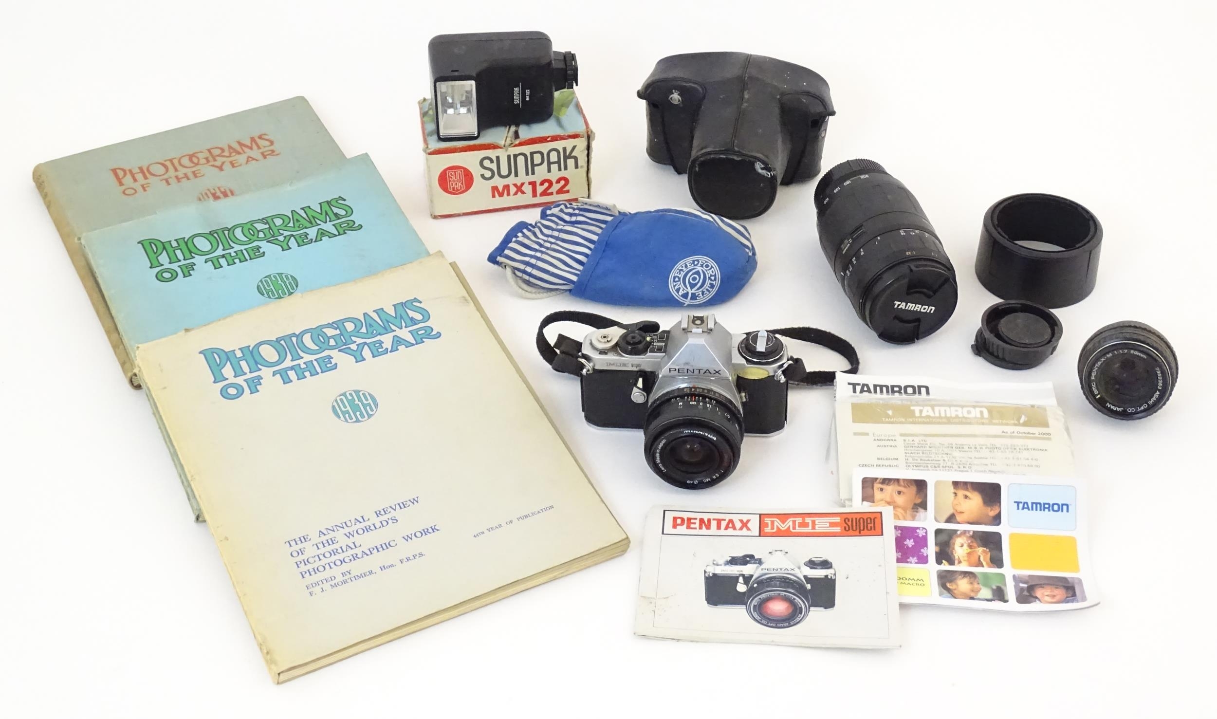 A quantity of mid 20thC camera equipment and photographic books to include a cased Pentax ME Super