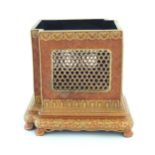 A Chinese brush pot of squared form with a burnt orange ground, reticulated / pierced panels and