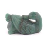 An Oriental hardstone spinach jade green coloured carving modelled as a duck. Indistinctly marked to