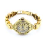 A ladies wristwatch with 18ct gold case and strap. Case approx 1" wide Please Note - we do not