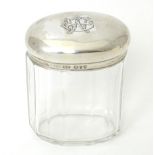 A Victorian glass dressing table jar of ovoid form with silver lid, hallmarked London 1893, maker