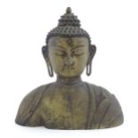 An Asian cast bronze bust modelled as a Buddha. Approx. 16 1/4" Please Note - we do not make