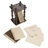 * Stationery Set. A child's set of notecards and envelopes in wooden stand, circa 1890s