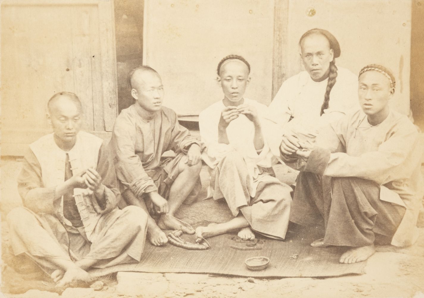 * China. Five seated Chinese men gambling, c. 1870s, albumen print