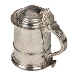 * Tankard. A Queen Anne silver tankard by Nathaniel Lock, London 1710