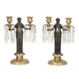 * Candle Stands. A pair of late 19th century French patinated and ormolu candle stands