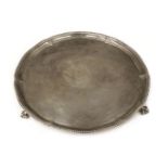 * Salver. A George III circular silver salver by Elizabeth Jones, London 1784