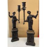 * Candle Stands. A pair of patinated brass candle stands