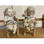 * Porcelain Infants. A pair of Edwardian porcelain figures