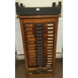 * Type cabinet. An 18 drawer Caslon type cabinet with brass type