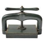 * Book press. A cast iron book press