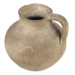 Roman. A Roman jug, grey body with handle, undecorated