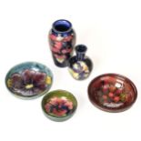 Moorcroft. A Moorcroft pottery Pansy pattern shoulder vase and other items