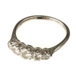 Ring. An 18ct gold and platinum five stone diamond ring