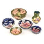 Moorcroft. A Moorcroft pottery Hibiscus pattern lidded bowl and other items