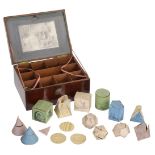 Educational Game. A boxed set of hand-made geometric shapes, circa 1830