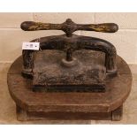 Book press. A cast iron book press