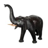 A LARGE LEATHER LIBERTY STYLE MODEL OF AN ELEPHANT