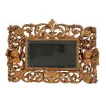 A CARVED GILTWOOD BAROQUE STYLE MIRROR