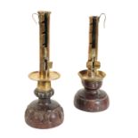 A MATCHED PAIR OF 17TH CENTURY BRASS AND CARVED WOOD CANDLESTICKS