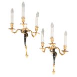 A PAIR OF GILT METAL FIGURAL WALL LIGHTS