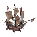 A CARVED AND PAINTED WOODEN MODEL OF A GALLEON