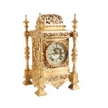 A GILT BRASS CASED MANTEL CLOCK