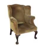 A GEORGE II STYLE WINGBACK ARMCHAIR