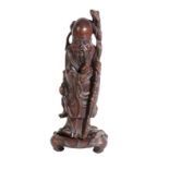 A CHINESE CARVED HARDWOOD FIGURE
