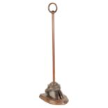 ARMY & NAVY STORES, LONDON: A BRASS AND HOOF DOORSTOP