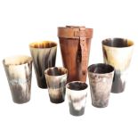 A SET OF SIX EDWARDIAN HORN GRADUATED DRINKING BEAKERS