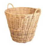 A CANE DOUBLE-HANDLED LOG BASKET