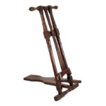 MAXWELL, LONDON: A MAHOGANY FREESTANDING BOOT JACK