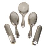 AN EARLY 20TH CENTURY SILVER MOUNTED DRESSING SET