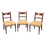 A SET OF EIGHT REGENCY STYLE MAHOGANY DINING CHAIRS