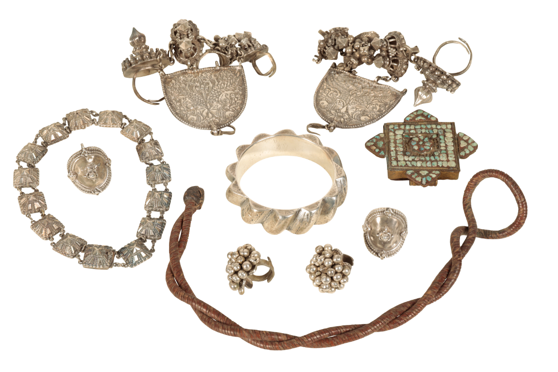 A COLLECTION OF NORTH AFRICAN WHITE METAL JEWELLERY